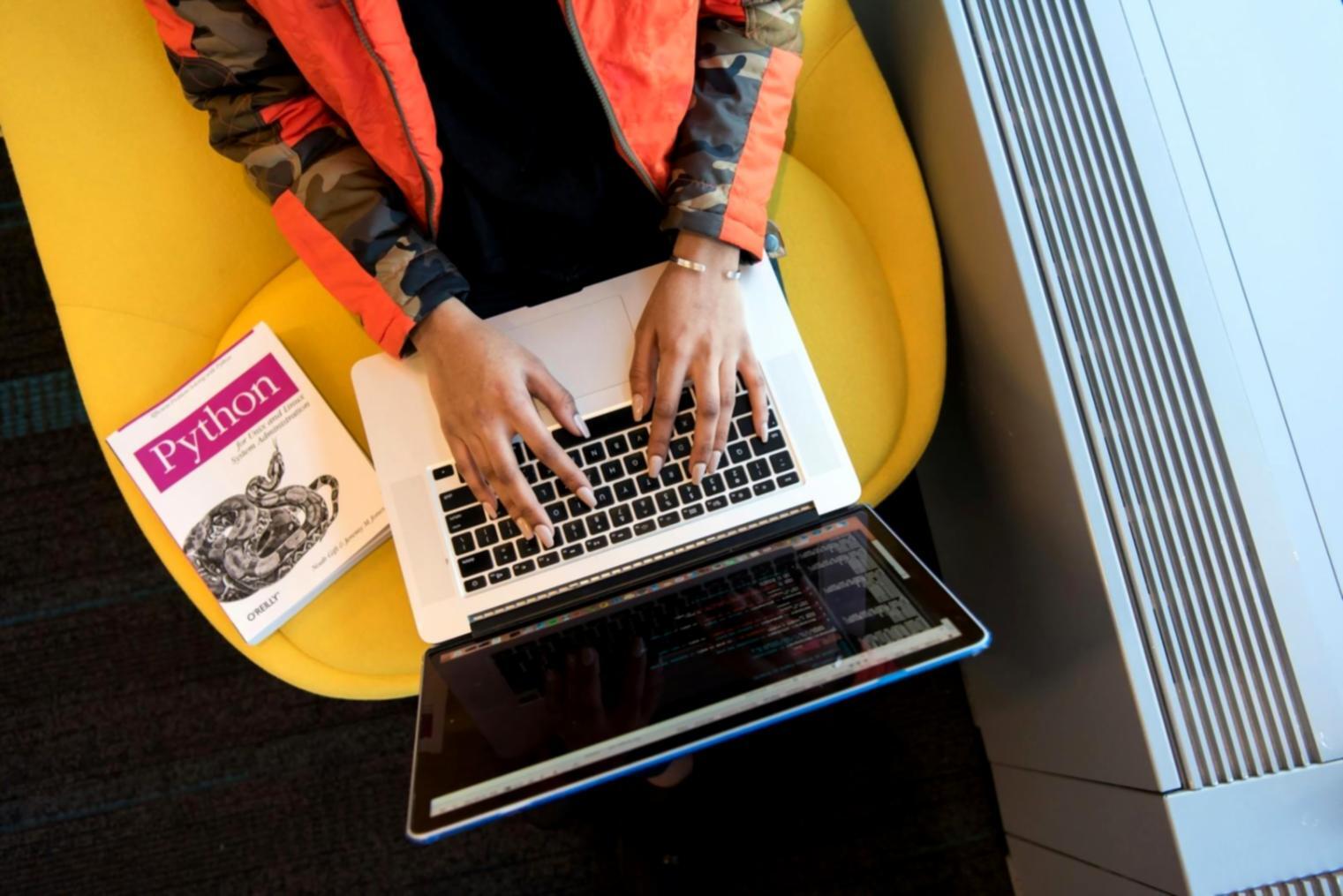 International students collaborating on creative AI project in classroom workspace